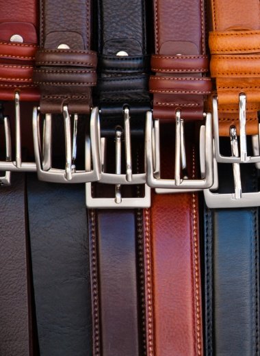 set of leather belts on display