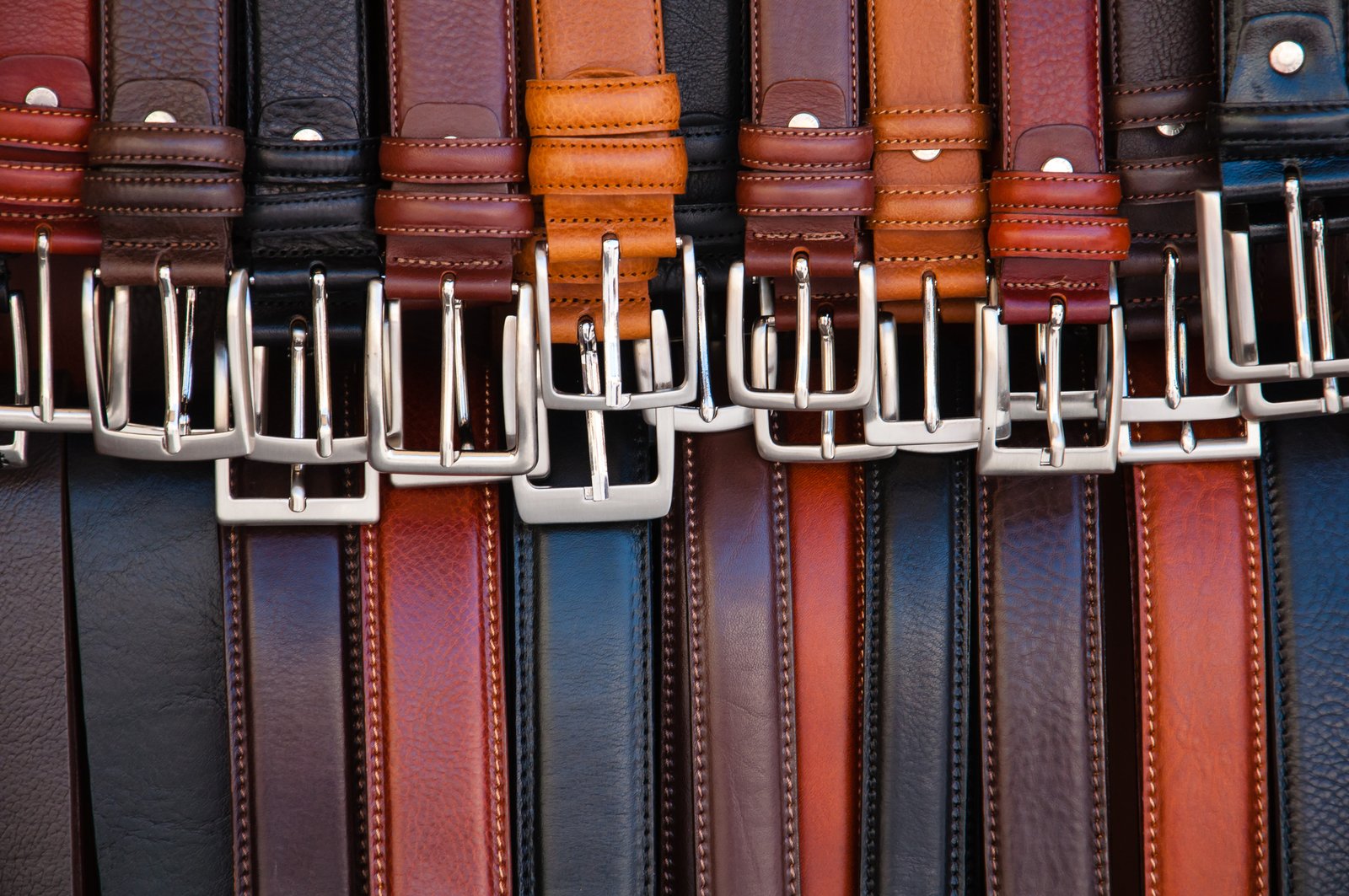 set of leather belts on display